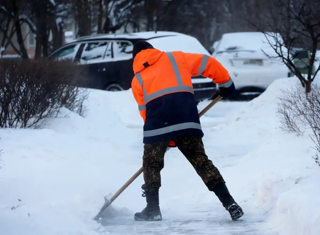 Element Turf & Outdoor Solutions - shoveling snow for commercial parking lot