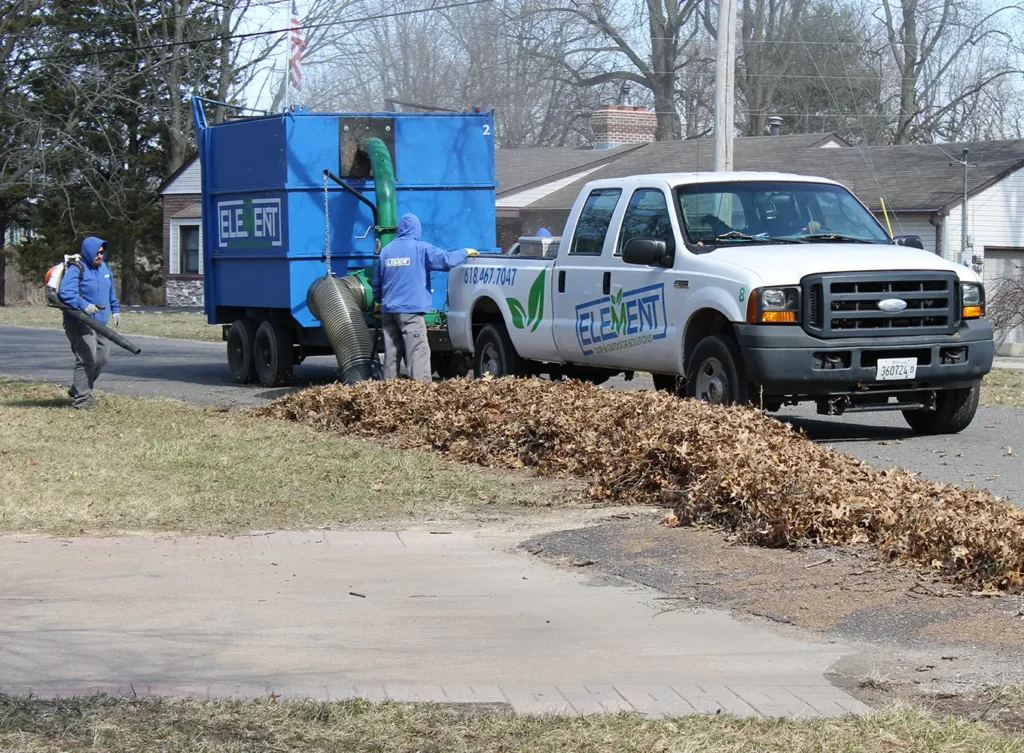 Element Turf & Outdoor Solutions - Team members doing curbside leaf pickup in Alton, IL.